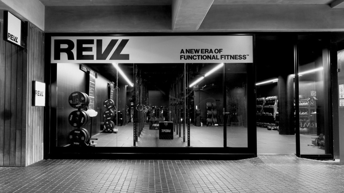 A REVL studio shopfront at night